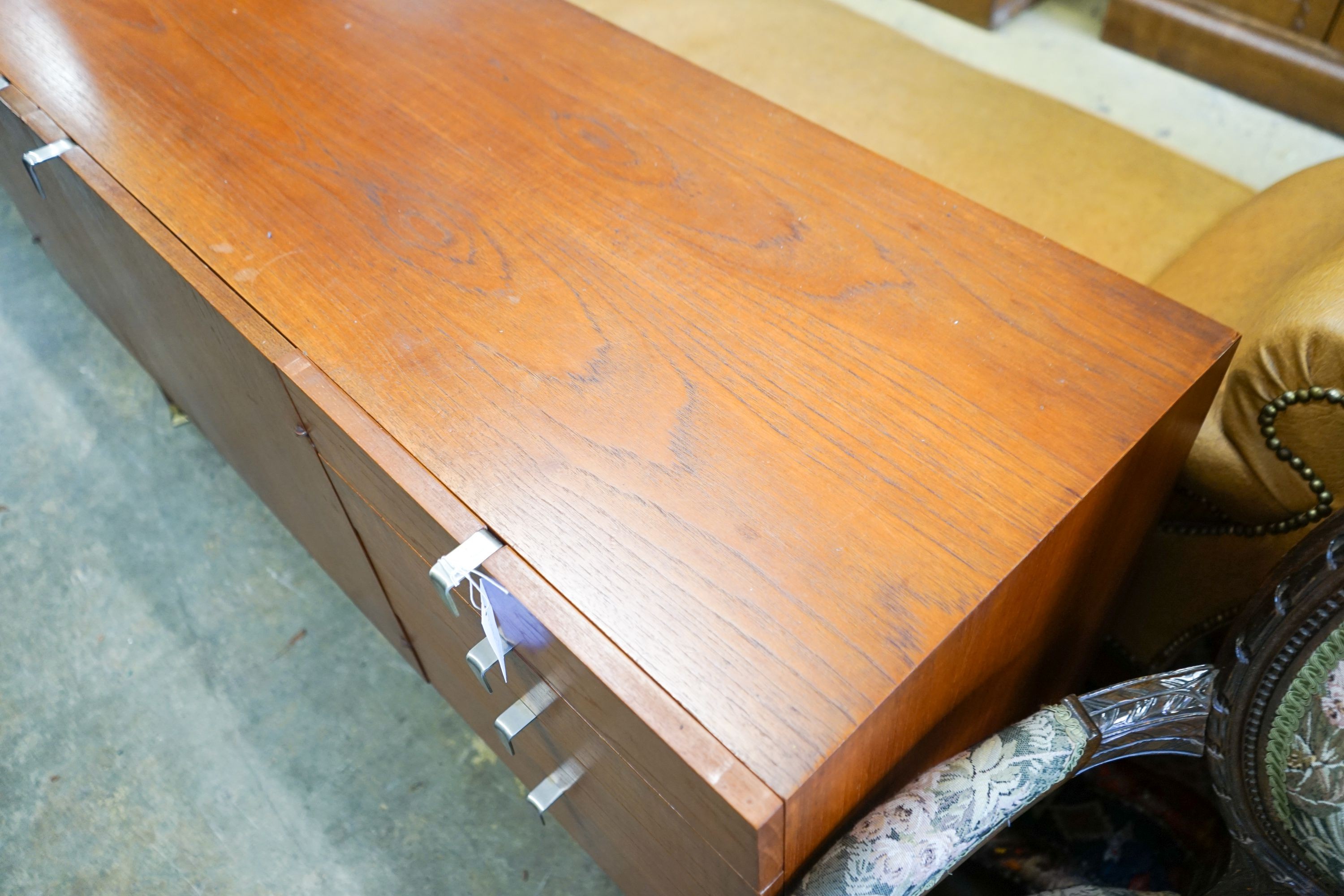 A mid 20th century Stag teak sideboard, length 137cm, depth 48cm, height 73cm